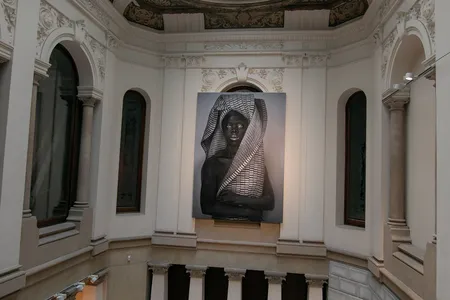 A print of a work by South African photographer Zanele Muholi hangs above the museum&#39;s staircase.