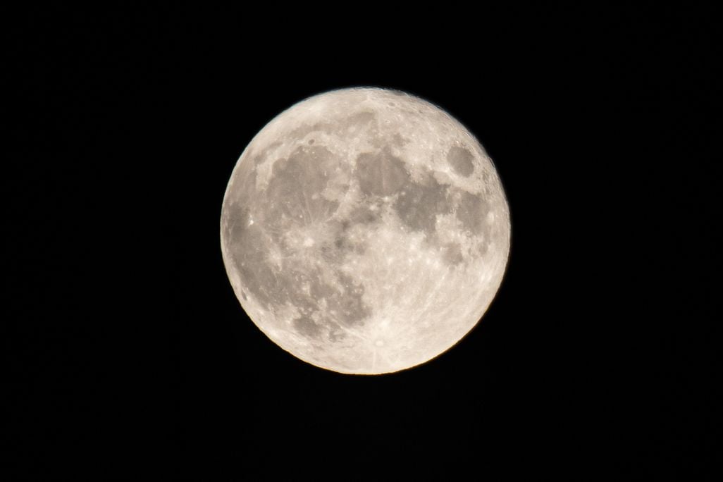 The Full Corn Moon as seen behind Hortiatis mountain over the city of Thessaloniki in Northern Greece, captured from Kalochori Lagoon and National Park.