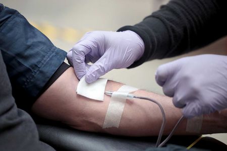 A volunteer donates blood during an event at the Field Museum in Chicago in May, 2020.