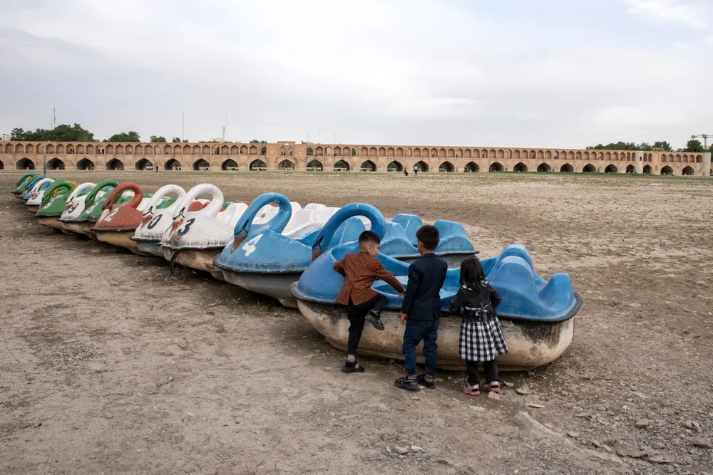 The thirty-three bridges of Isfahan, the absence of a river in it, and the boats waiting for water.