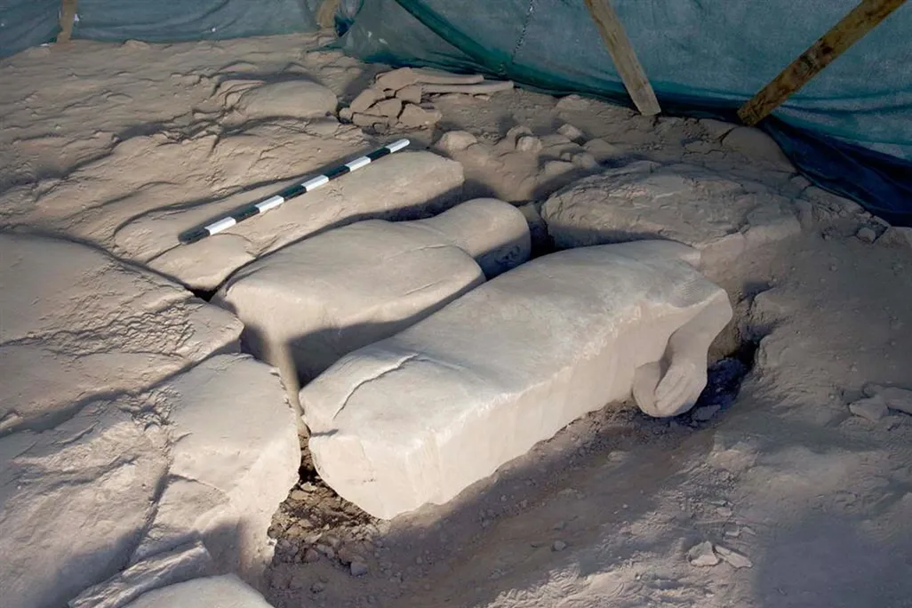Marble statue pieces lying face down