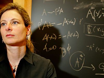 Physicist Lisa Randall believes an extra dimension may exist close to our familiar reality, hidden except for a bizarre sapping of the strength of gravity as we see it.