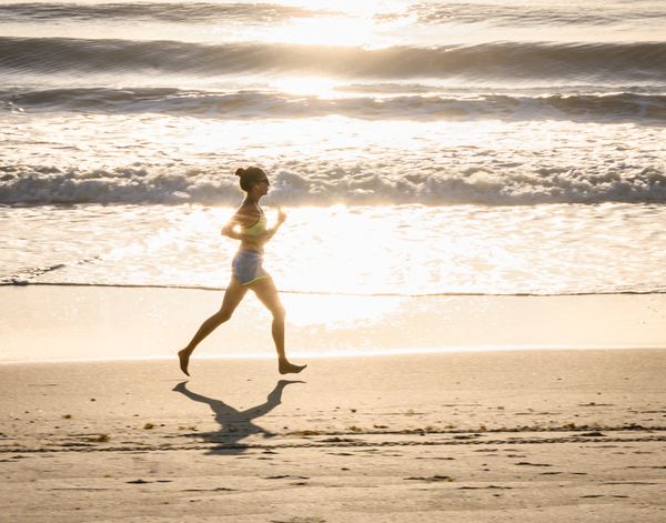 A girl running on the beach thumbnail
