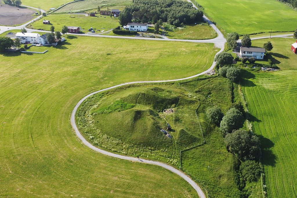 Grassy area with an oddly shaped mound in the middle