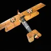 A wood and fabric World War I-era Curtis JN-4D aircraft is on display at the National Air and Space Museum. It has tan wings, and a brown and blue fuselage.