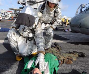 100813-N-1287L-037
ATLANTIC OCEAN (Aug. 13, 2010) Members of the crash and salvage team check a Sailor for injuries during a mass casualty exercise on the flight deck of the aircraft carrier USS Enterprise (CVN 65). Enterprise is underway conducting tailored ship's training availability and is making preparations for its 21st deployment. (U.S. Navy photo by Mass Communication Specialist 2nd Class Stacy D. Laseter/Released)