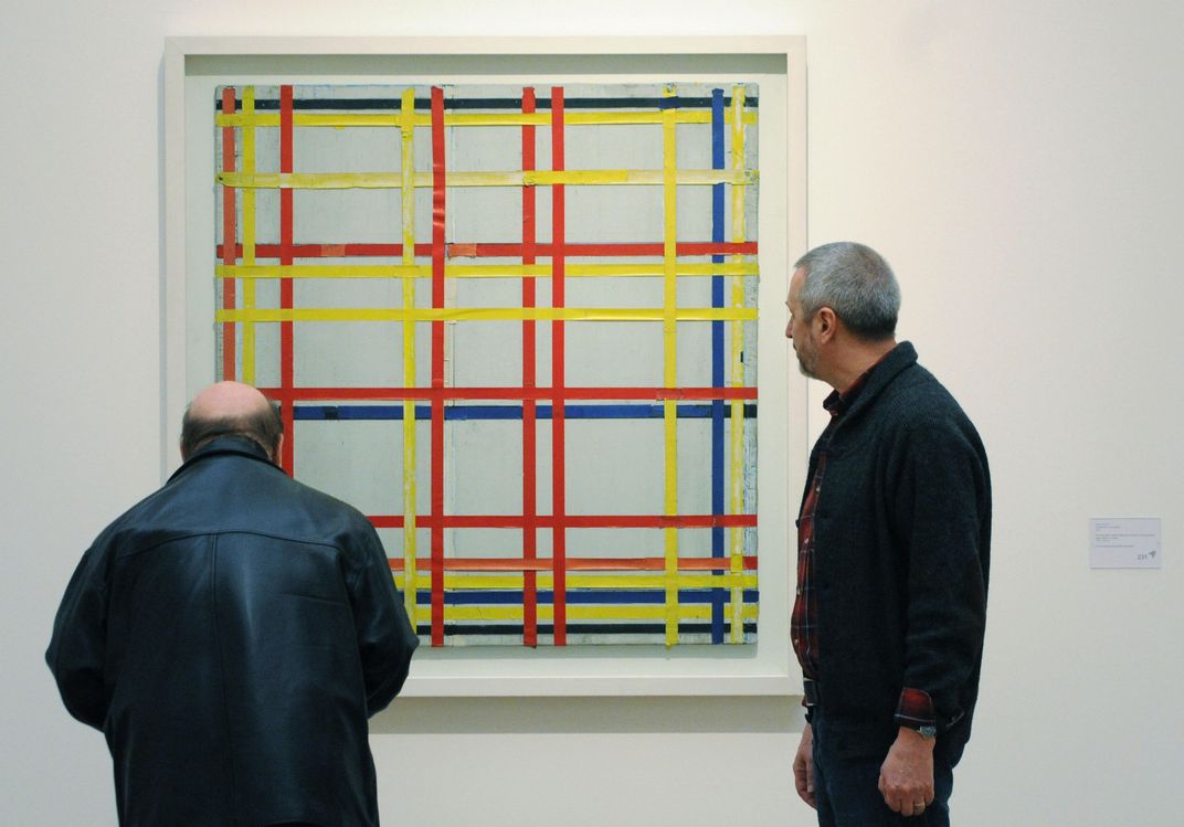 Two men inspect New York City I at an exhibition in 2007