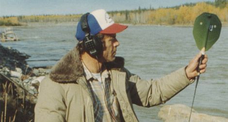 A biologist with a salmon tracking device