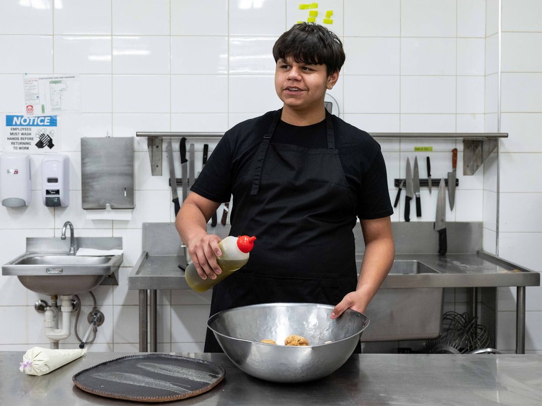 A high school student in a cooking class