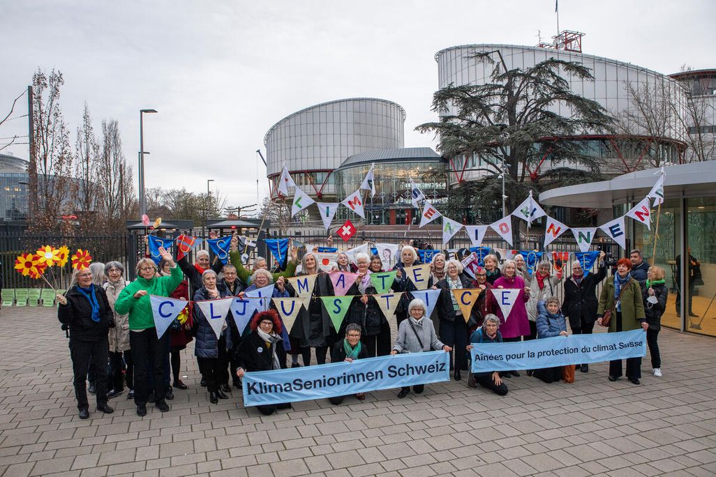 Group of seniors with climate change signs