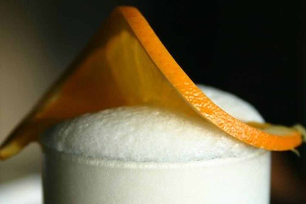 The foamy head of a Ramos gin fizz