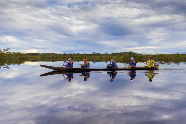 Travelers in the floodplains of the Inirida River, in the department of Guavire, Colombia thumbnail