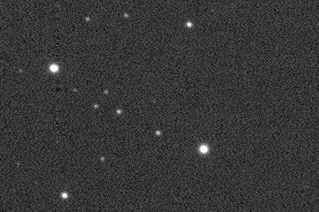 As part of the Star Songs project, X-ray emissions from the EX Hydrae system (above, near center)—in which one star pulls matter from its partner—are converted into music.