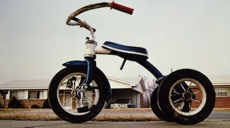 “A Democracy of Images,” open today at the American Art Museum, features 113 images that span the history of American photography, including William Eggleston’s Tricycle (Memphis), c. 1975.