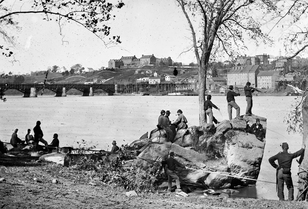 Union soldiers on the island in 1861, with Georgetown visible in the distance