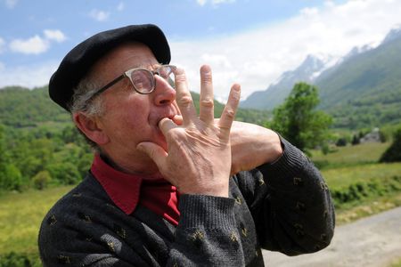 A man in Laruns, southwestern France, whistling as a form of speech. Like others in the Canary Islands and elsewhere, local people have learned to whistle their language to communicate across long distances. Linguists are studying whistled speech to help understand which sound elements are essential to comprehension.