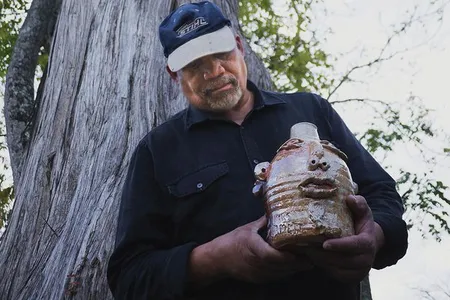 Jim McDowell holds his jug, “Emmett Till.”