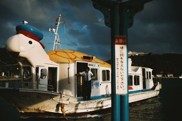 Turtle boat under a double rainbow thumbnail