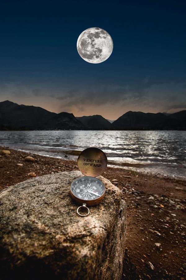 A Combined Exposure of the Full Moon, Compass, and Dillon Reservoir in Colorado thumbnail