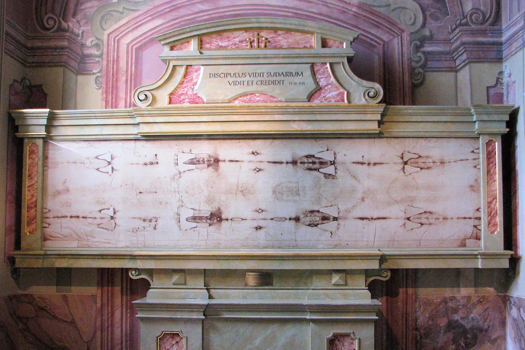 A long cloth with markings on it in a frame