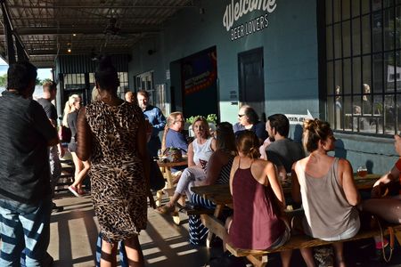 On a summer Friday, people gather at O'Connor Brewing Co. in Norfolk, Virginia.