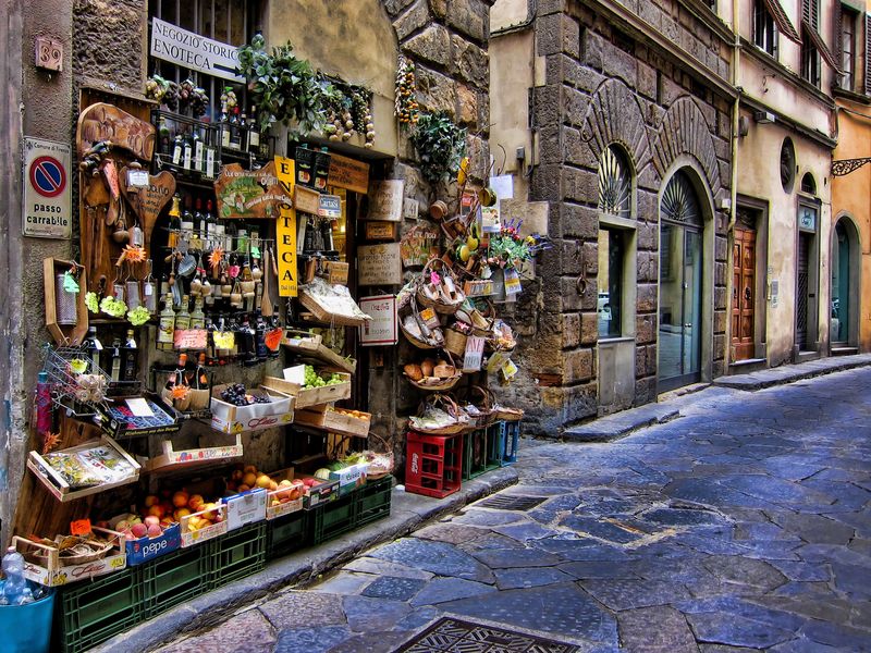 A shop in Florence Italy with most goods displayed outside