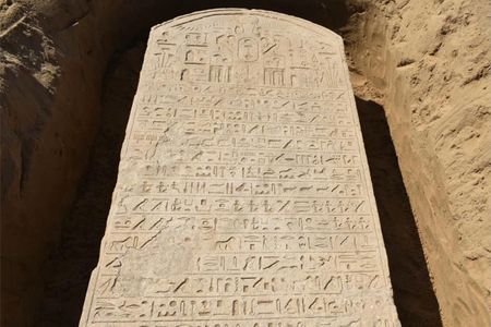 Archaeologists are working to decipher the slab's 15 lines of hieroglyphs.