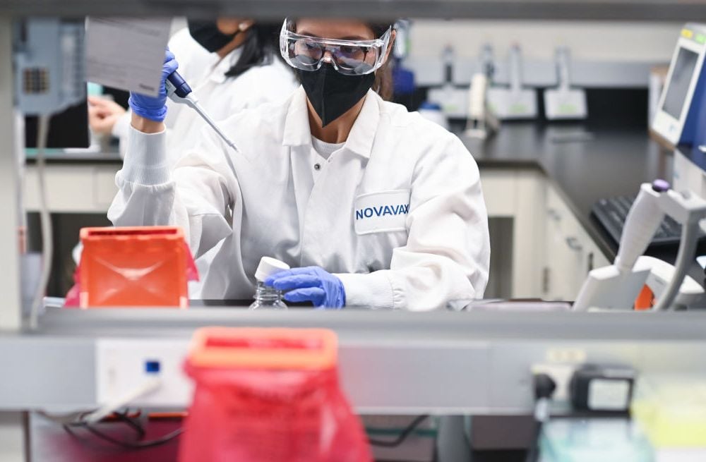 An image of a woman working in a Novavax laboratory