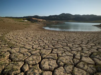 Dry and cracked ground at the La Vinuela reservoir near M&aacute;laga, Spain, last year. Reservoirs in the country&#39;s Catalonia region have fallen to 16 percent capacity amid years of drought and extreme heat.