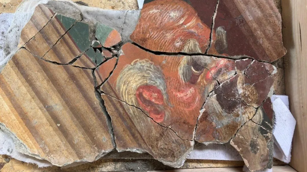 Fragments of frescoes depicting a mask