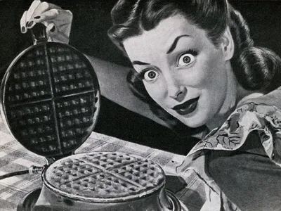 A vintage illustration of a wide-eyed housewife with a waffle in a waffle iron, 1946.