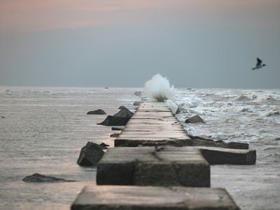 Water breaks against Galveston Island&rsquo;s century-old seawall. The barrier was an engineering marvel in the early 1900s, but the island needs more protection today.