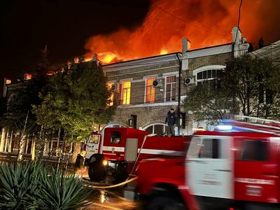 Firefighters work to control the blaze at the National Art Gallery in Abkhazia on January 21.