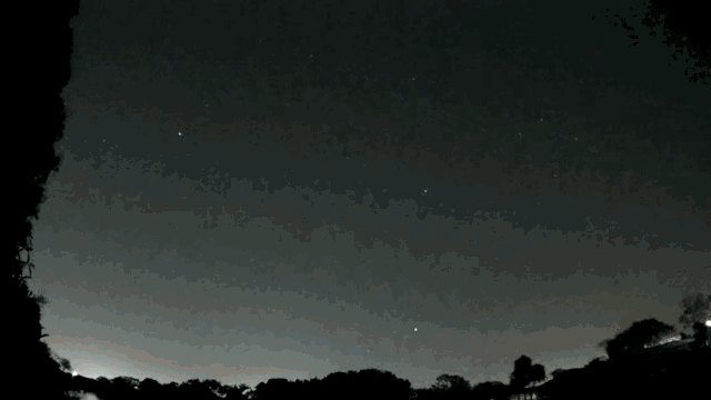 A gif of a meteor exploding over the Floridian night sky