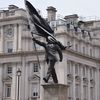 Attributed to Banksy, a New Statue of a Suited Man, Blinded by a Flag and Walking Off a Ledge, Appeared in Central London icon