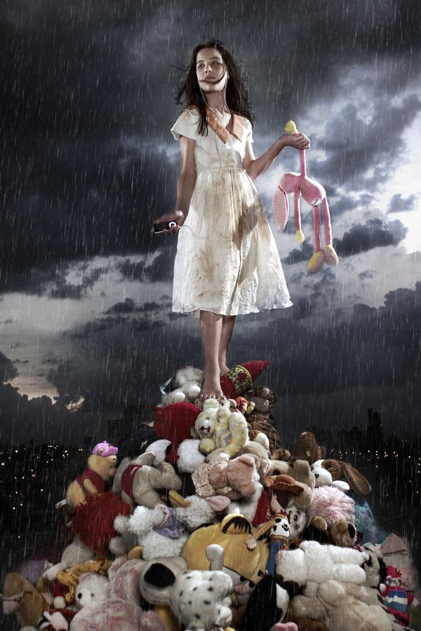 Girl on top of teddy bears piramid. thumbnail