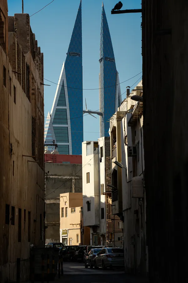 Old Manama alleyways contrasted with the rise of modern Bahrain thumbnail
