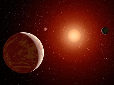 Artist's concept of a red dwarf star with a retinue of planets.