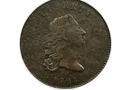 The copper prototype dates to 1794, the year that the U.S. Mint first struck its famed "Flowing Hair" silver dollars.