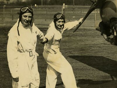 Rubye Berau (left) with her human cargo, parachutist Babe Smith, circa 1930s. 