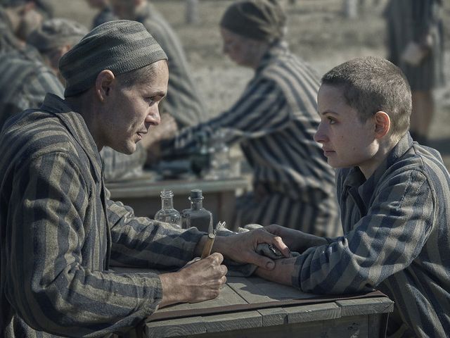 Lali (played by Jonah Hauer-King) and Gita (Anna Pr&oacute;chniak) in &quot;The Tattooist of Auschwitz,&quot; a new mini-series based on Heather Morris&#39; 2018 novel of the same name