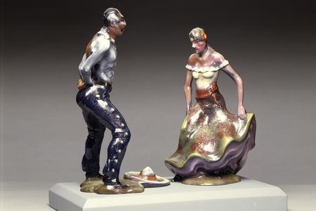 Fiberglass sculpture of a man and a woman at a fiesta.