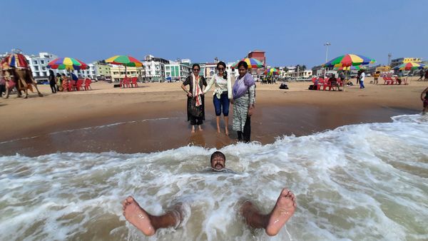 tourists enjoying bath in sea at Puri, India thumbnail