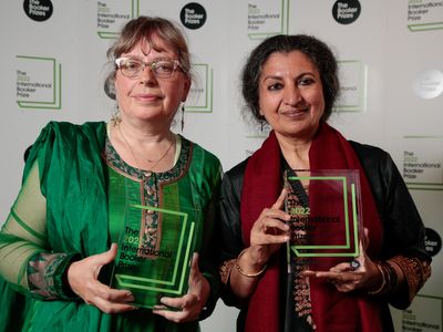 Translator Daisy Rockwell and author Geetanjali Shree hold their International Booker Prize awards.
