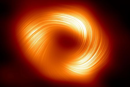 The new image of the Milky Way&#39;s black hole, seen in polarized light. It shows the organized magnetic fields that surround the black hole itself, from which no light can escape.