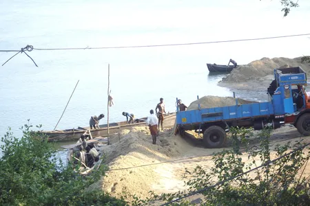 Sand Mining on the banks of the Sita River near Mabukala bridge in Brahmavar, India