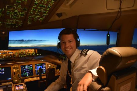 Connor Shields in the cockpit of a 777, which he flies around the world for Southern Air. The company provides long-haul cargo service, operating 777 and 737 freighters, for customers like DHL. Shields’ first flight—at age four—was in a Douglas DC‑3.