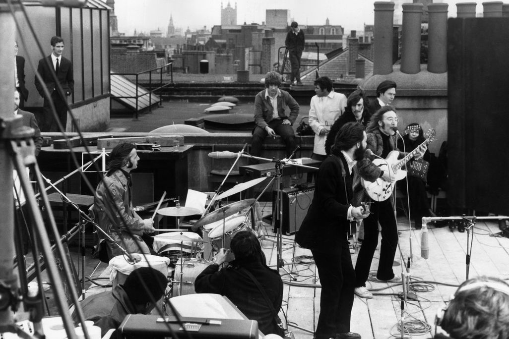 The Beatles performing on a rooftop
