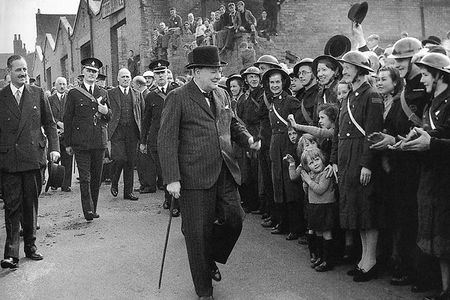 Winston Churchill visits bomb-damaged Birmingham, England, during the Blitz.