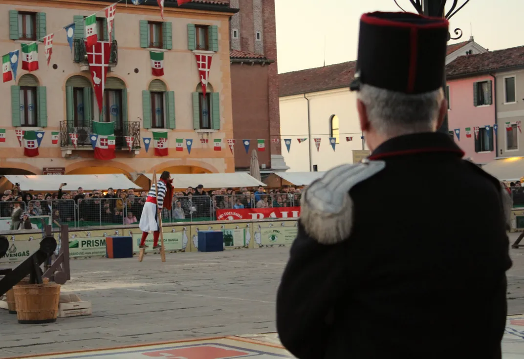 man competes on stilts
